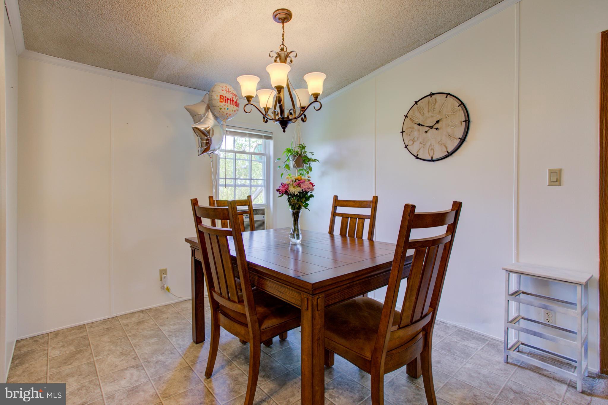 494 Compass Road Gap, PA 17527 - Photo 122 of 127 a view of a dining room with furniture a chandelier and wooden floor