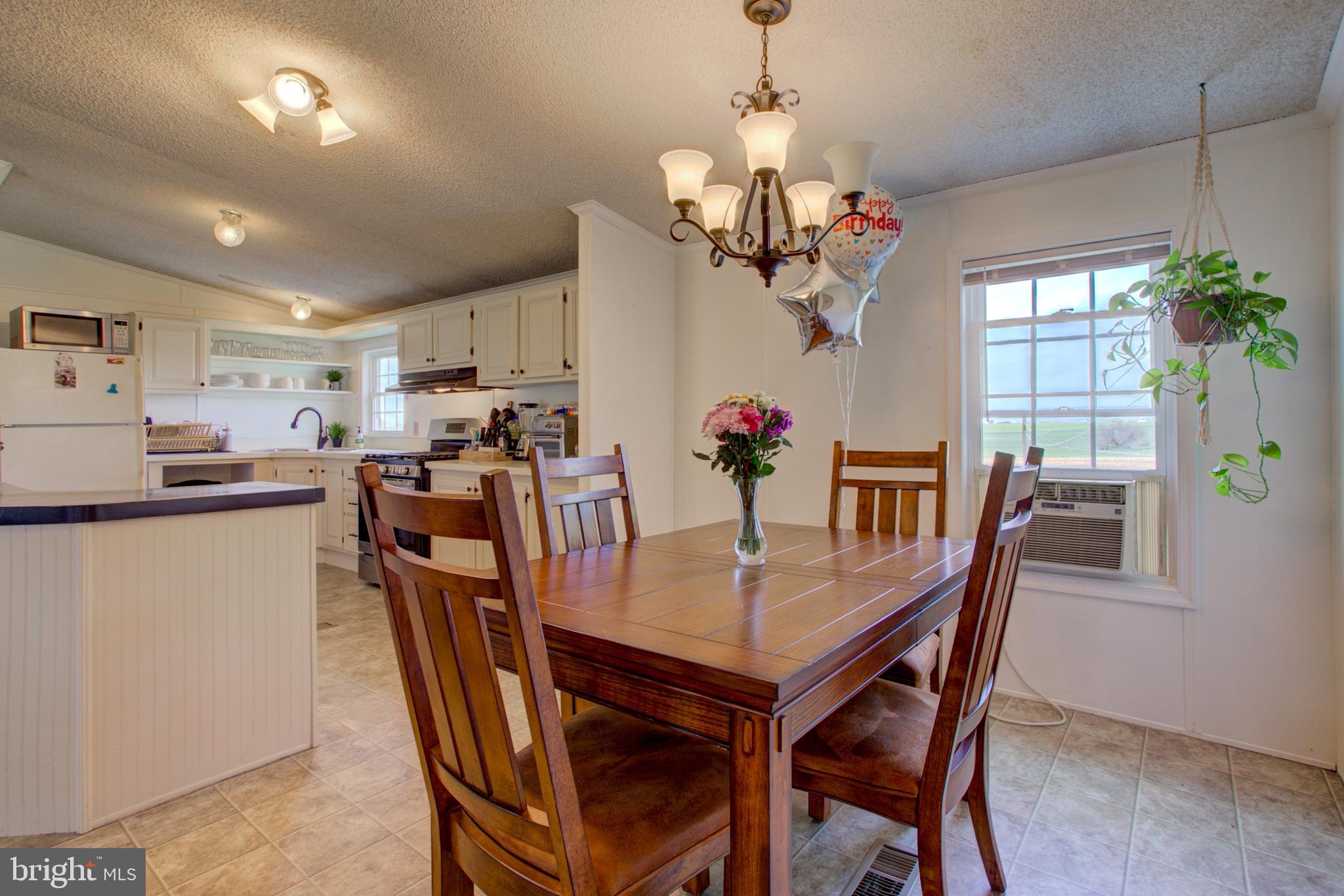 494 Compass Road Gap, PA 17527 - Photo 123 of 127 a view of a dining room with furniture window and wooden floor