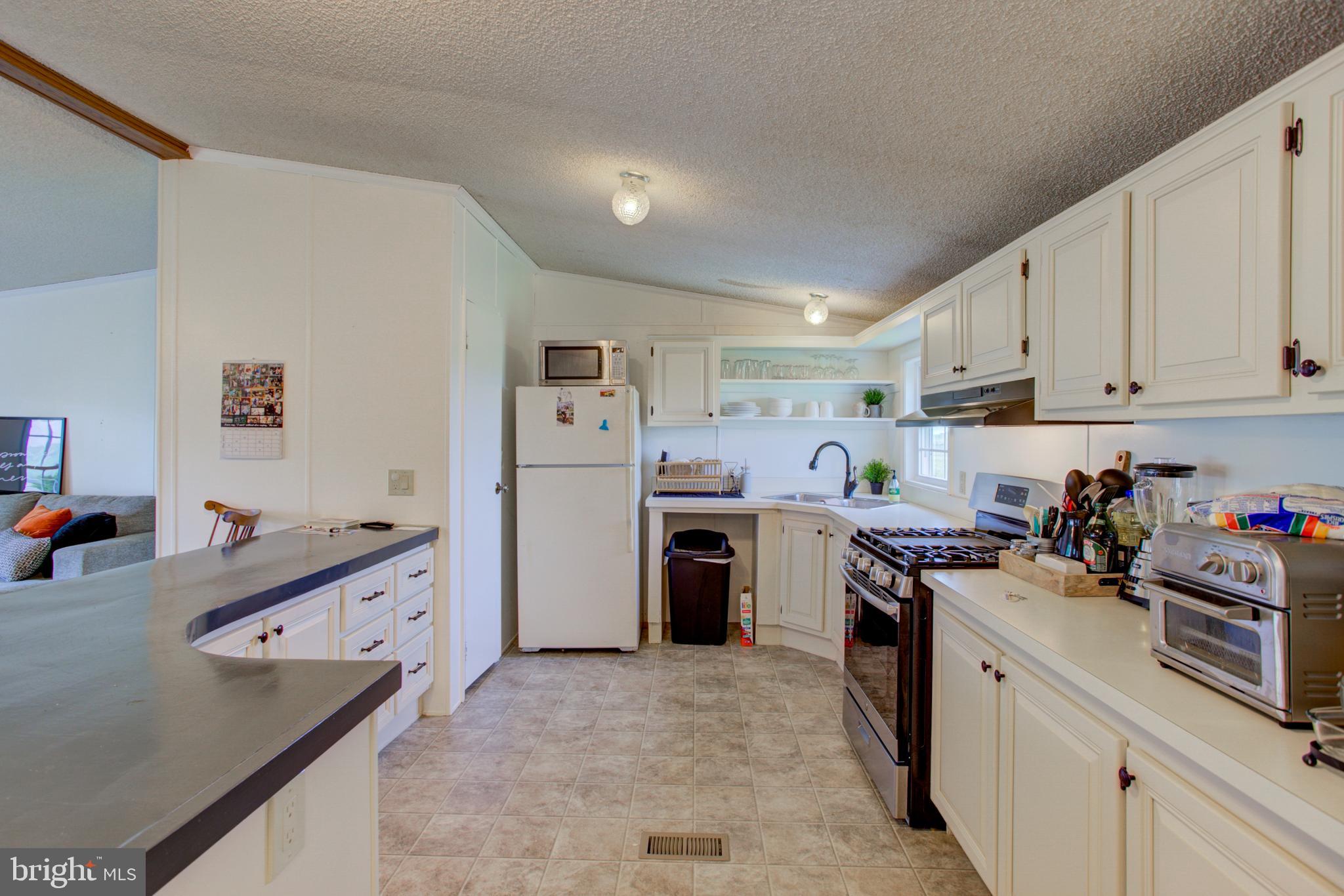 494 Compass Road Gap, PA 17527 - Photo 124 of 127 a kitchen that has a lot of cabinets in it and wooden floors