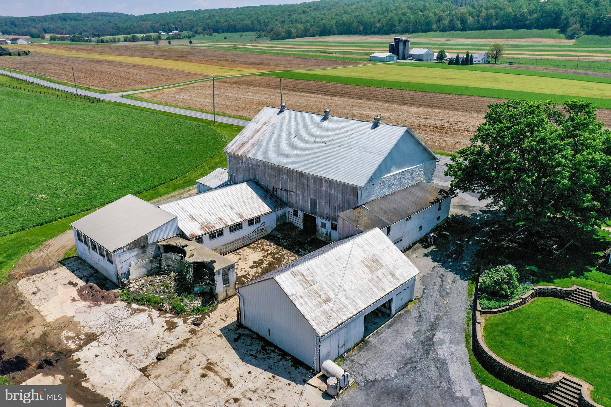 494 Compass Road Gap, PA 17527 - Photo 15 of 127 an aerial view of a house with a garden and lake view