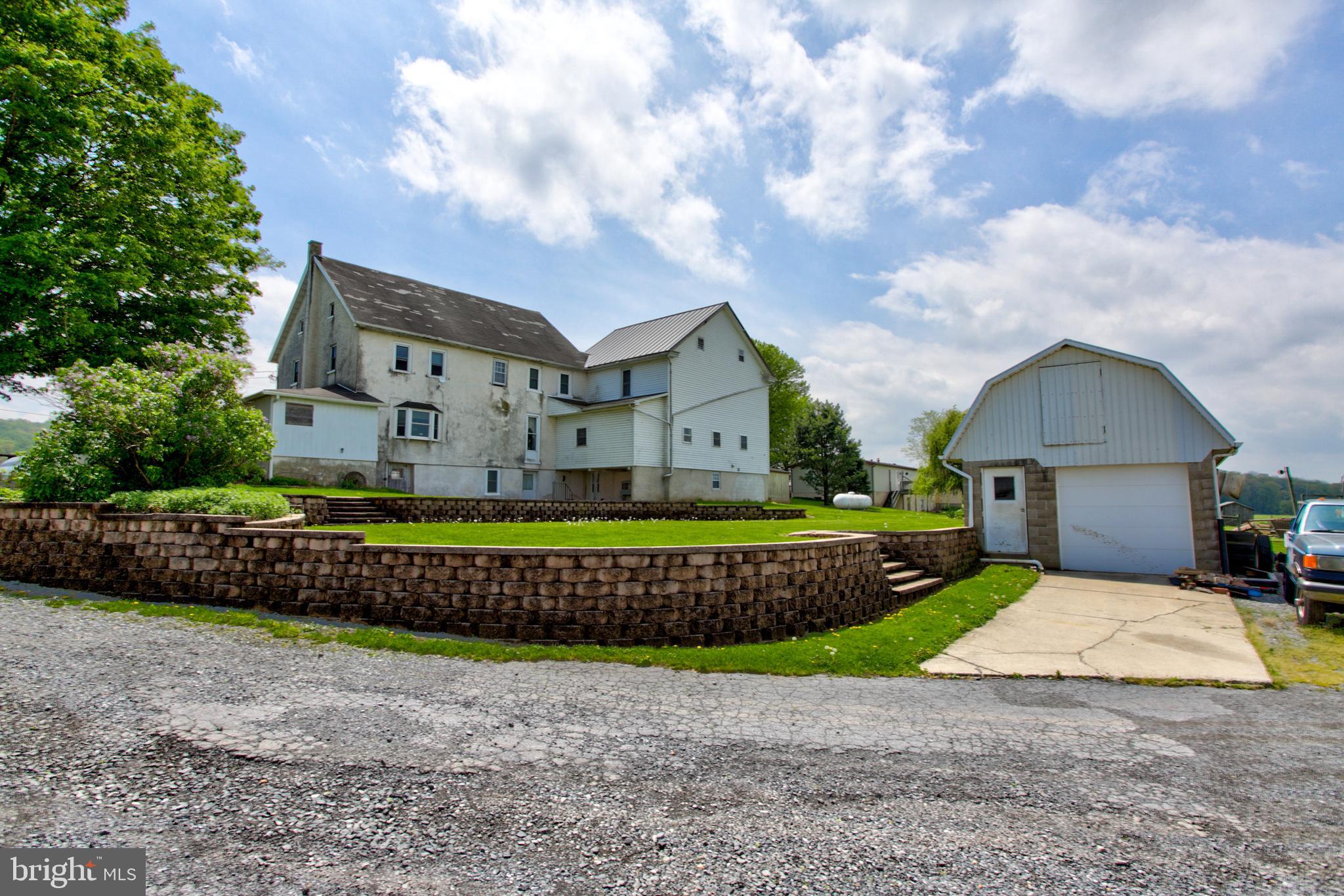 494 Compass Road Gap, PA 17527 - Photo 25 of 127 a front view of a house with a yard and garage