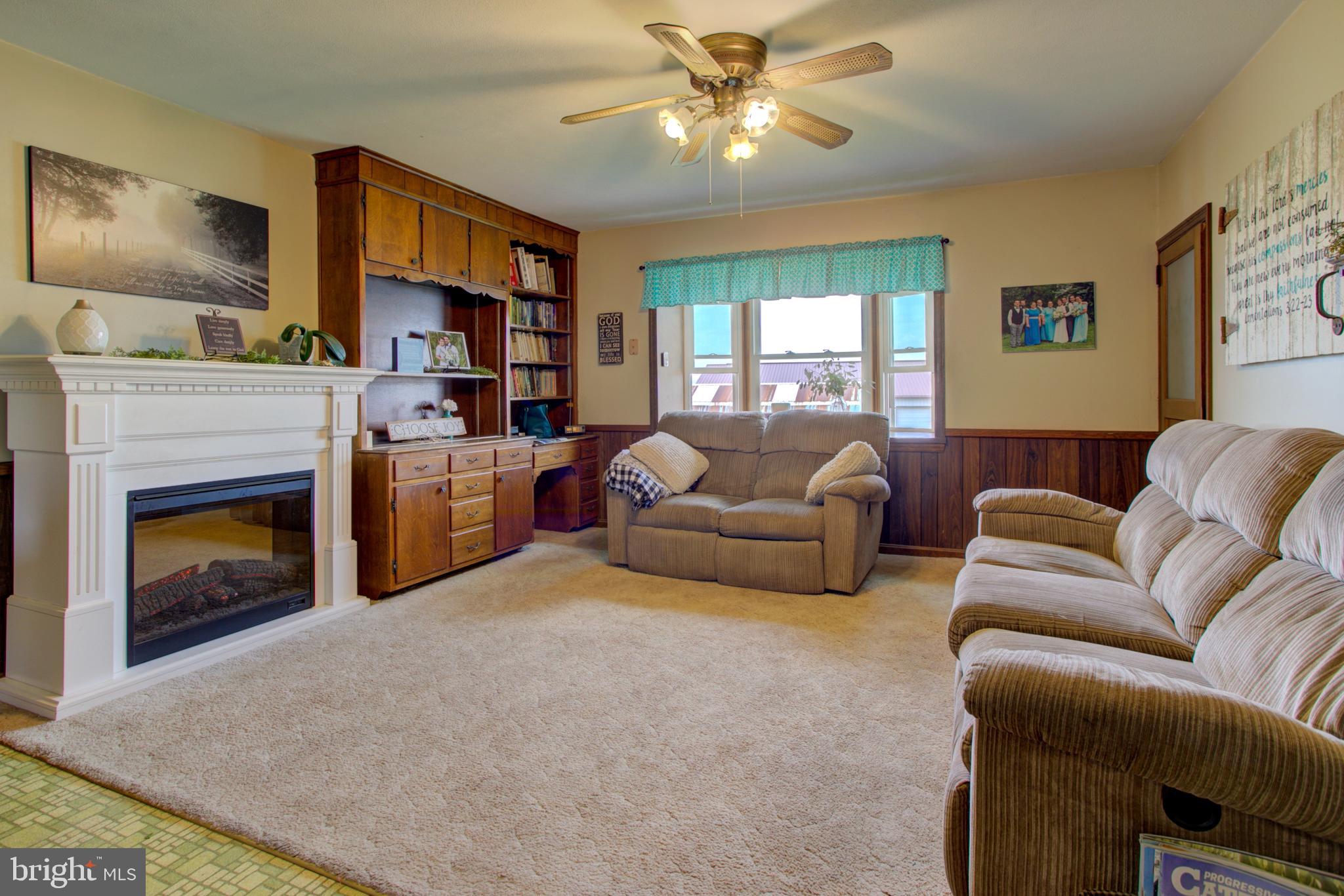 494 Compass Road Gap, PA 17527 - Photo 65 of 127 a living room with furniture fireplace and a window