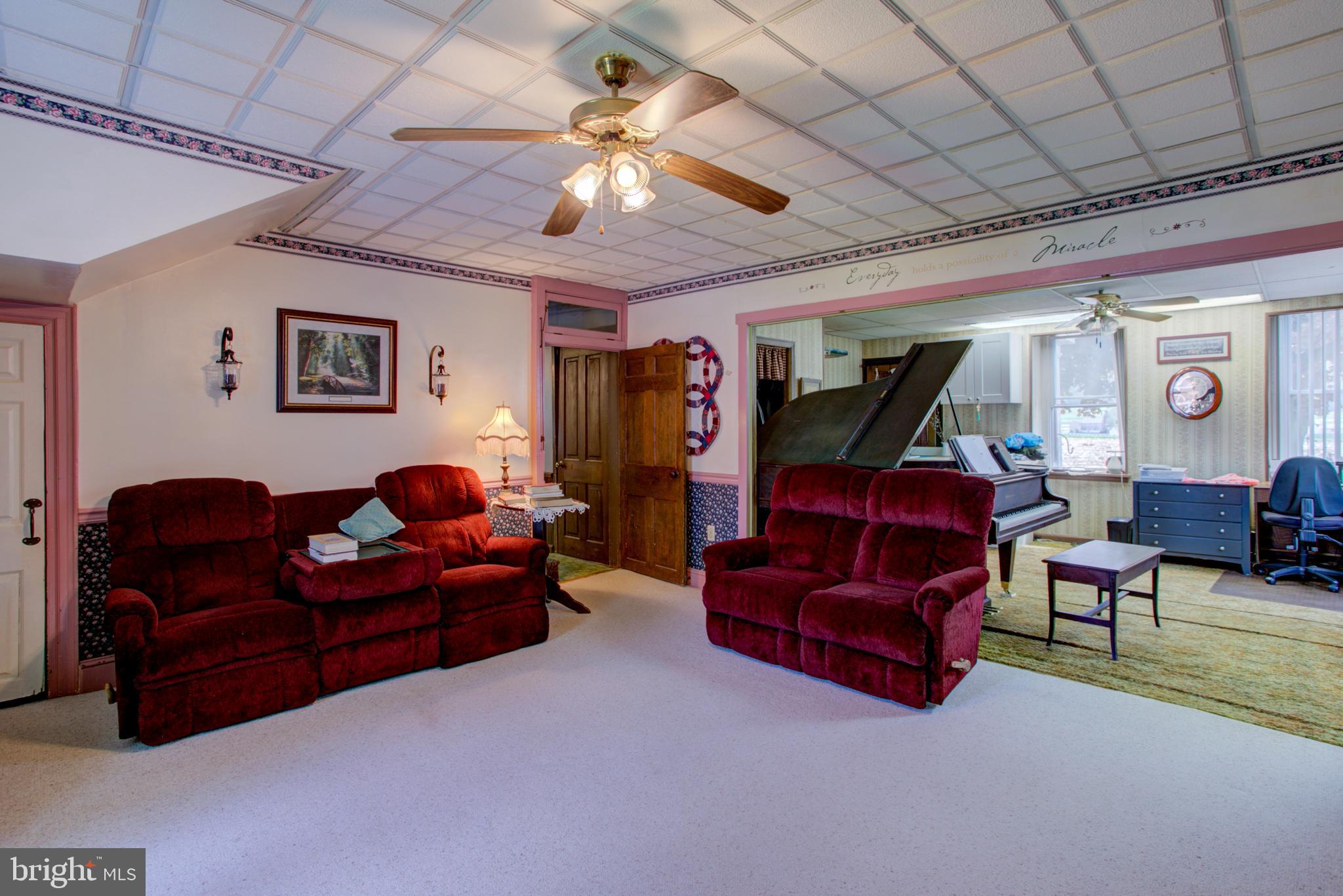 494 Compass Road Gap, PA 17527 - Photo 68 of 127 a living room with furniture and a chandelier