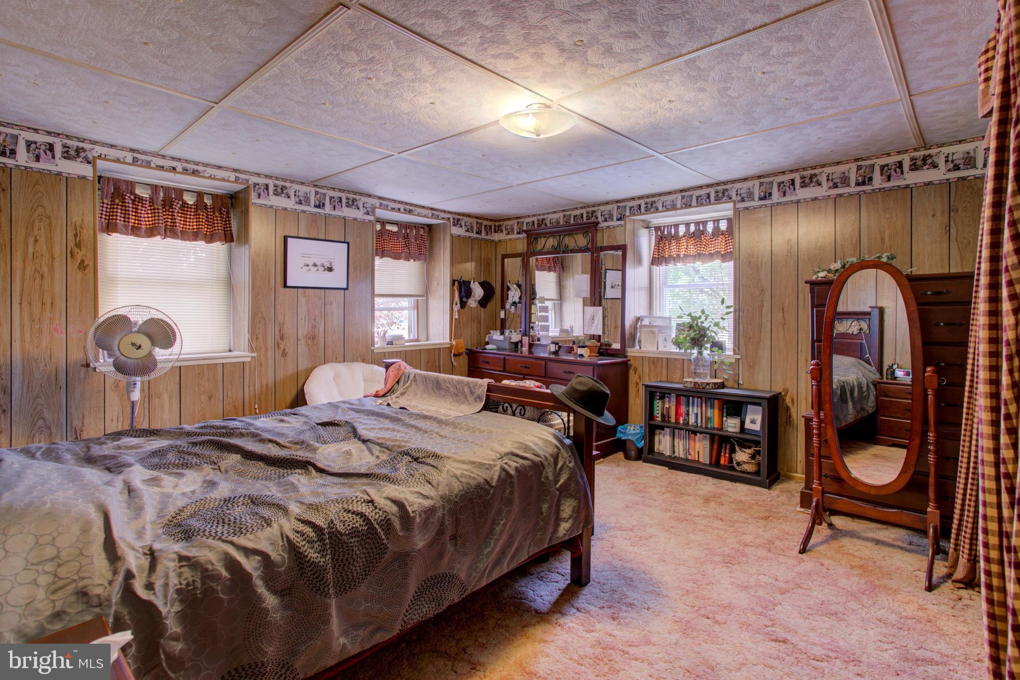 494 Compass Road Gap, PA 17527 - Photo 82 of 127 a bedroom with a bed and a dresser next to a window