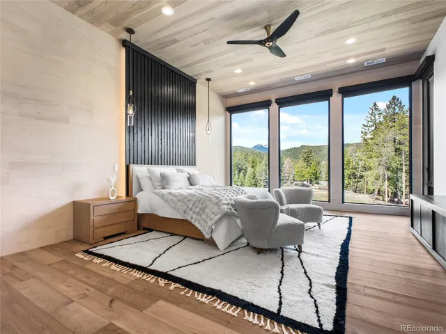 a bedroom with furniture and windows