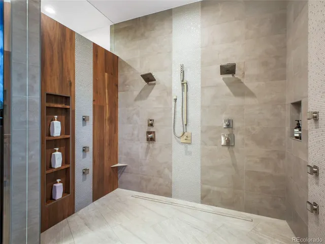 a bathroom with a shower and a sink