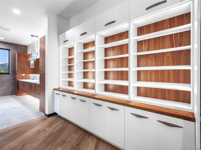 a kitchen with stainless steel appliances double vanity and sink