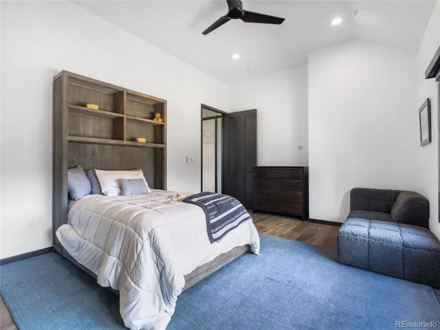 a bedroom with a bed and a couch