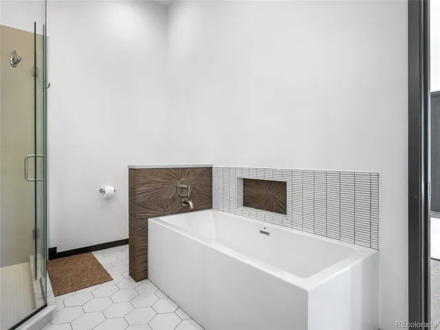 a bathroom with a tub and sink