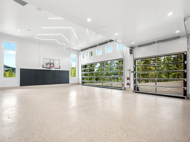 a view of a room with gym equipment and a large window