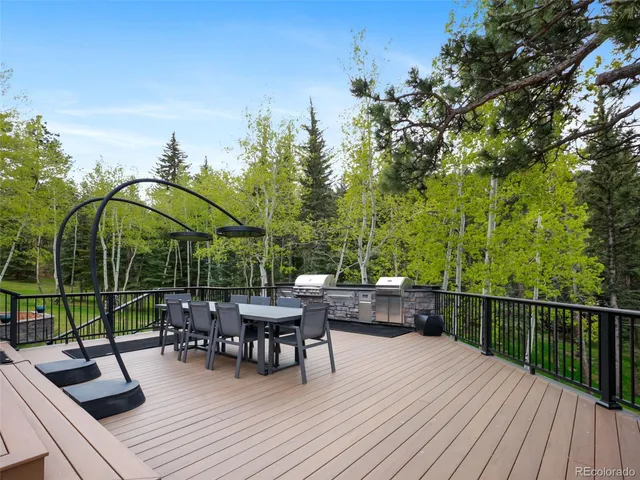 a view of backyard with sitting area