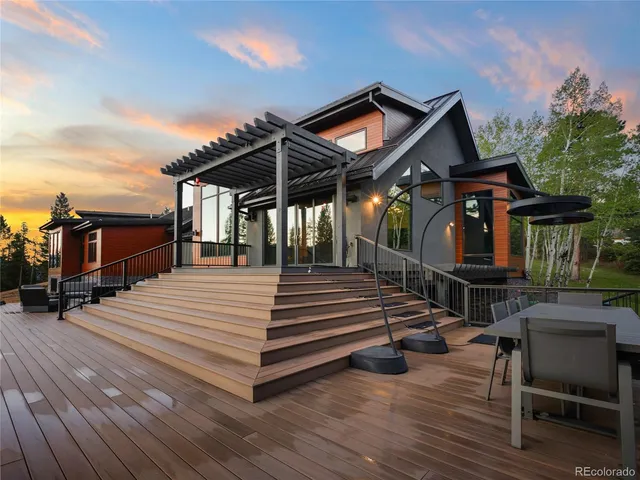 a view of a chairs and table on the deck