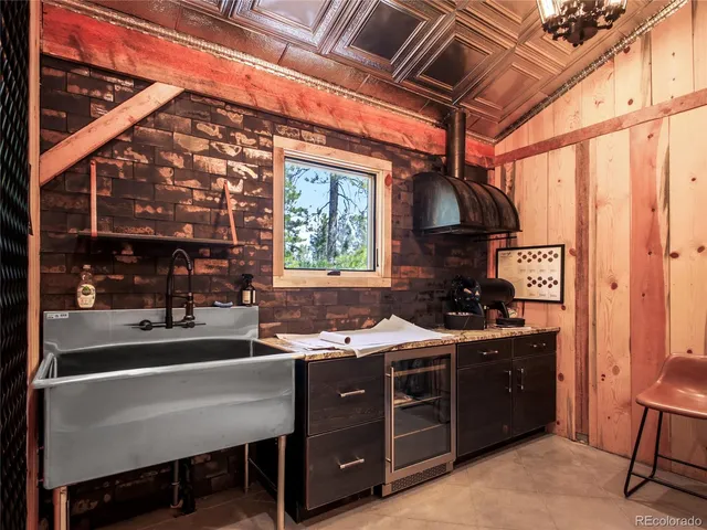 a kitchen with a sink appliances and cabinets