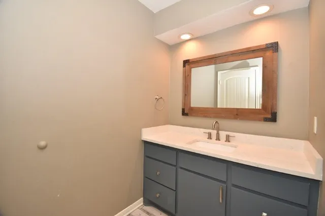 a view of room with window ceiling fan and hardwood floor