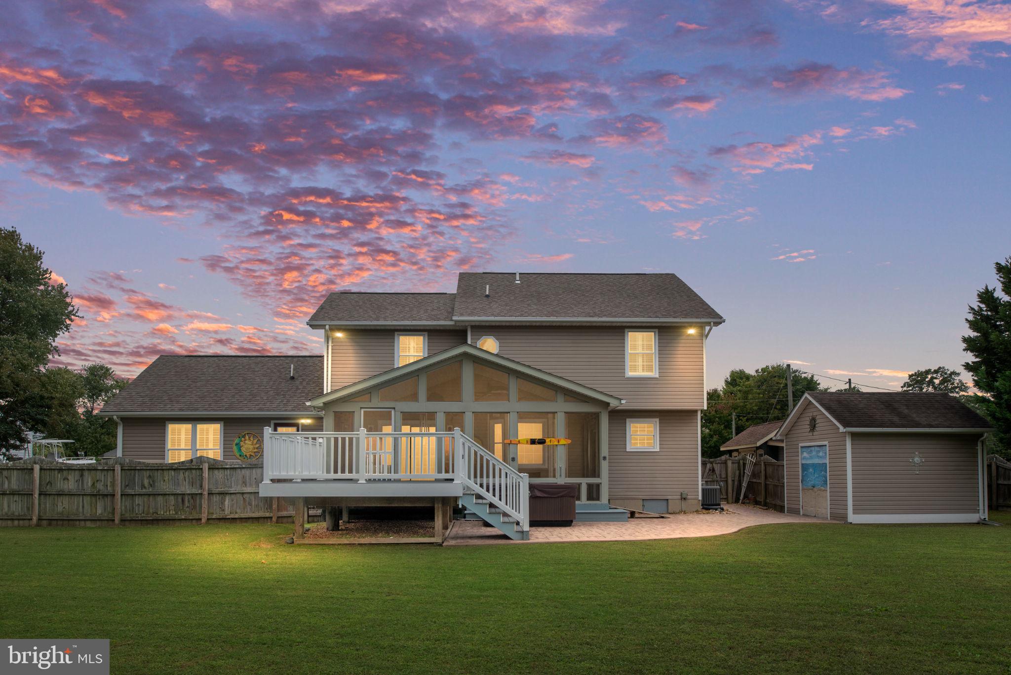 95 Potomac Lane Colonial Beach, VA 22443 - Photo 11 of 101 a front view of a house with a garden and lake view