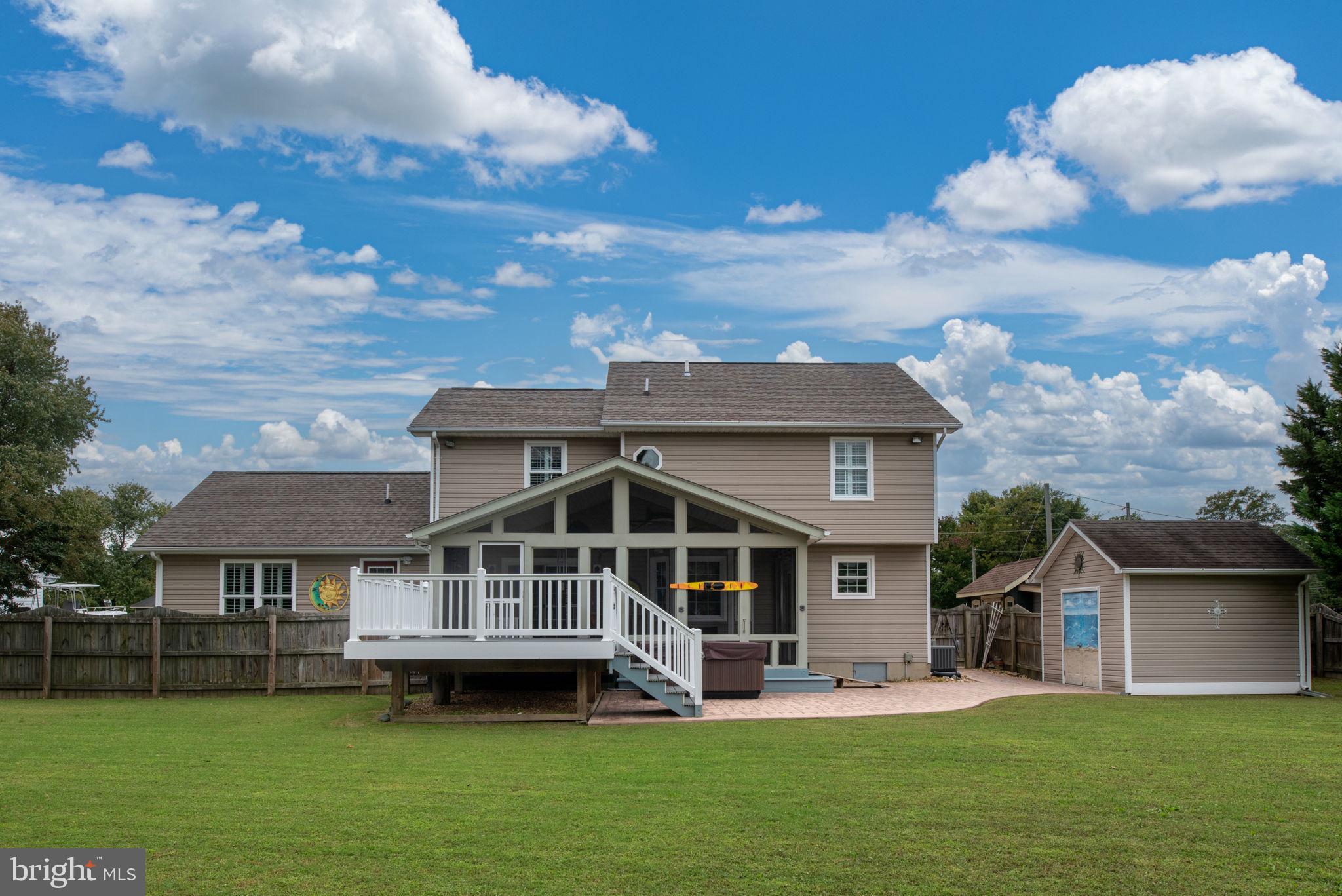 95 Potomac Lane Colonial Beach, VA 22443 - Photo 14 of 101 a front view of a house with a garden and trees
