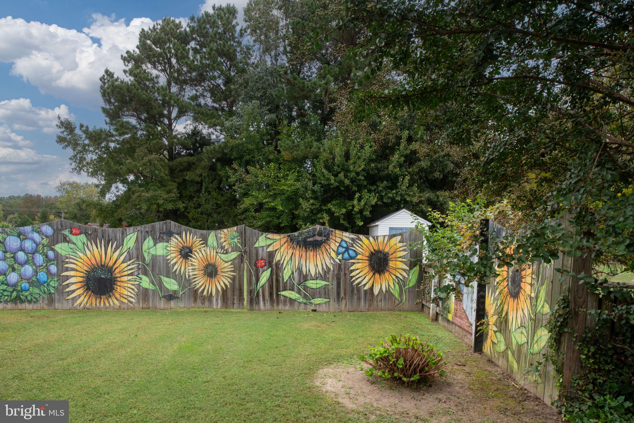 95 Potomac Lane Colonial Beach, VA 22443 - Photo 28 of 101 Beautifully painted fence giving a happy vibe!
