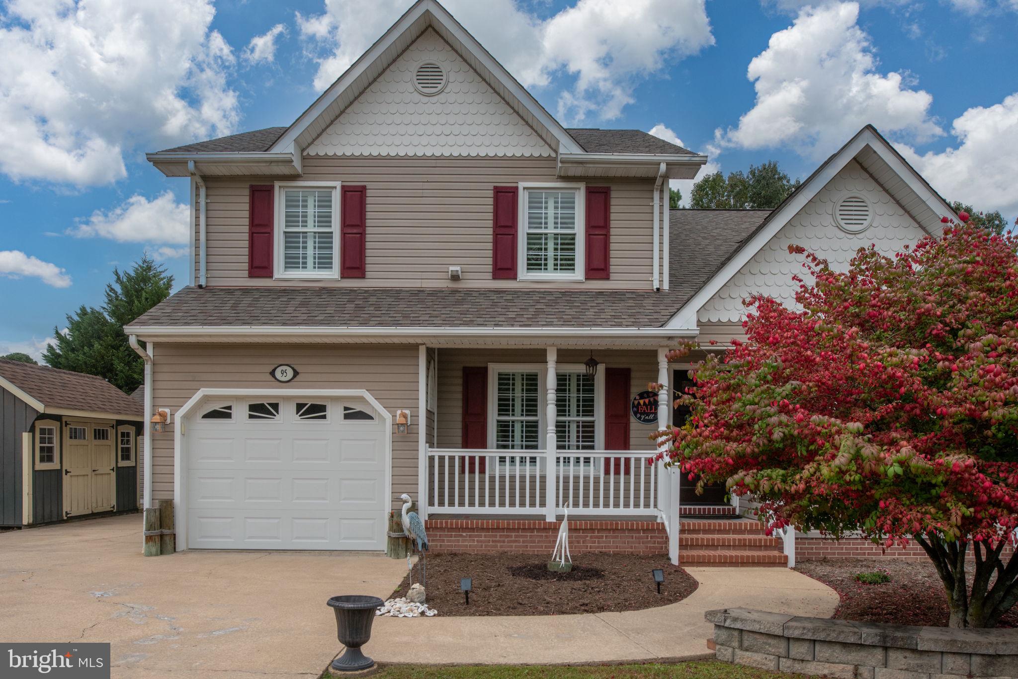 95 Potomac Lane Colonial Beach, VA 22443 - Photo 4 of 101 a front view of a house with a garden