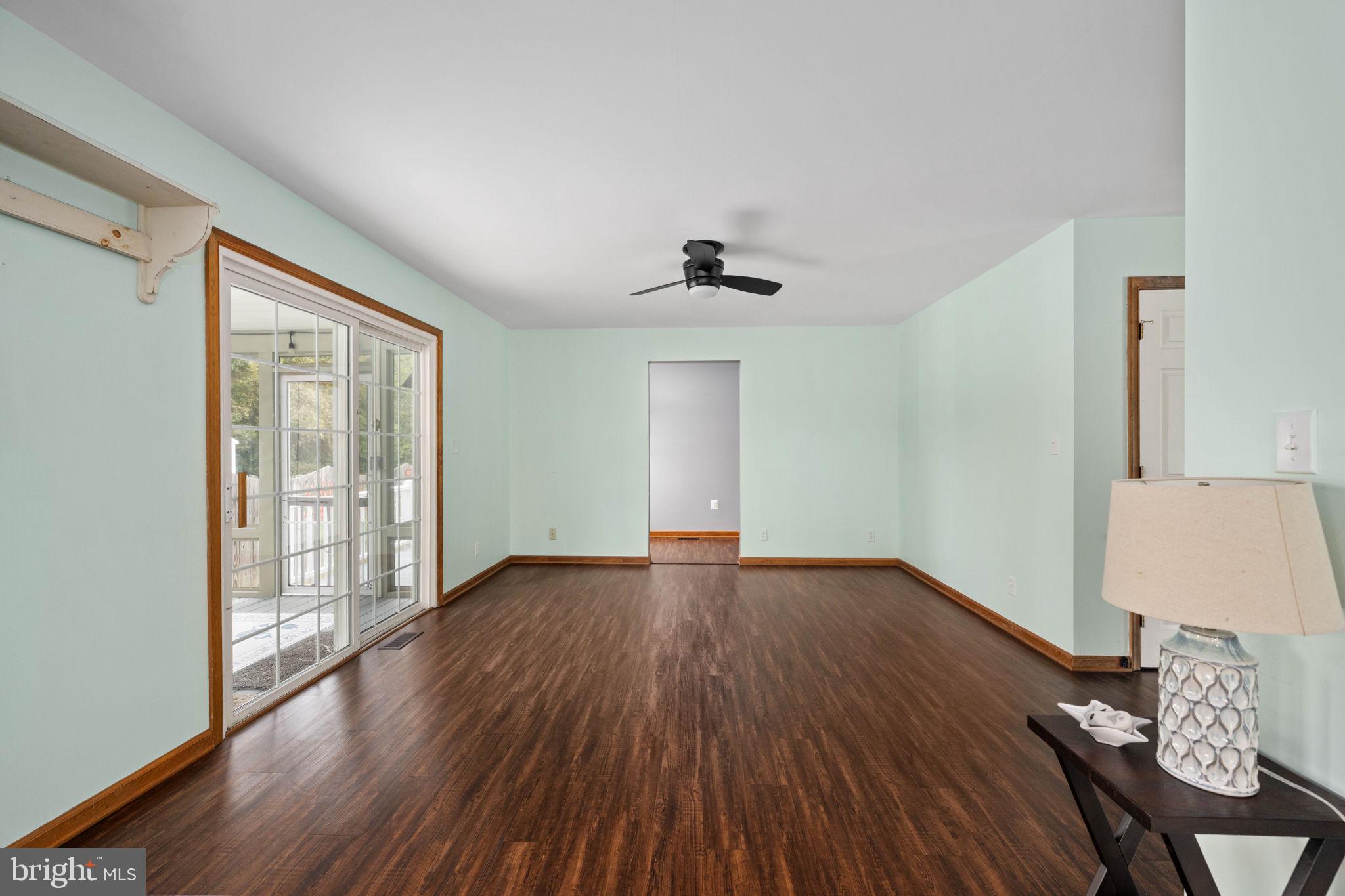 95 Potomac Lane Colonial Beach, VA 22443 - Photo 60 of 101 an empty room with wooden floor and windows
