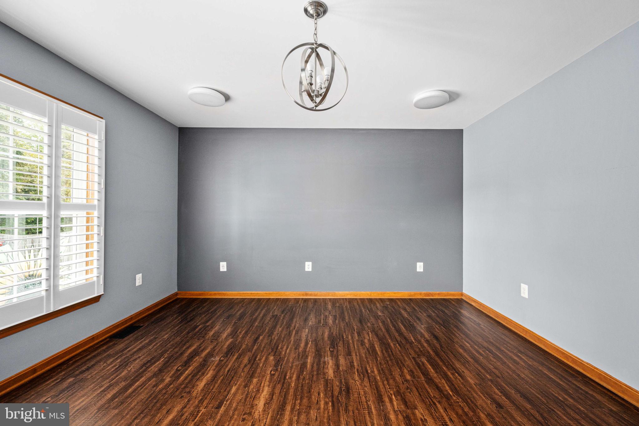 95 Potomac Lane Colonial Beach, VA 22443 - Photo 69 of 101 a view of an empty room with wooden floor and a window
