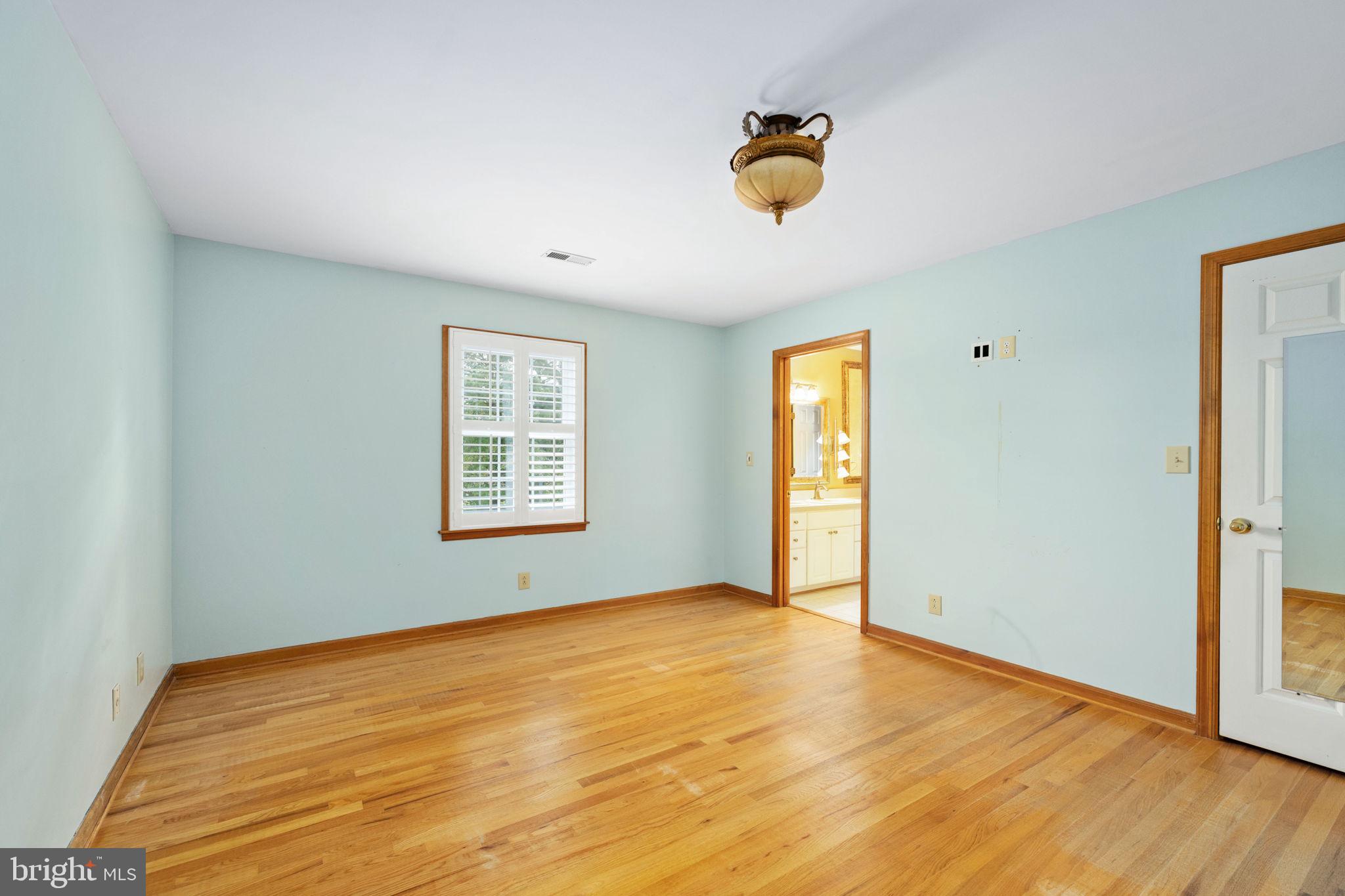 95 Potomac Lane Colonial Beach, VA 22443 - Photo 85 of 101 a view of an empty room with window and wooden floor