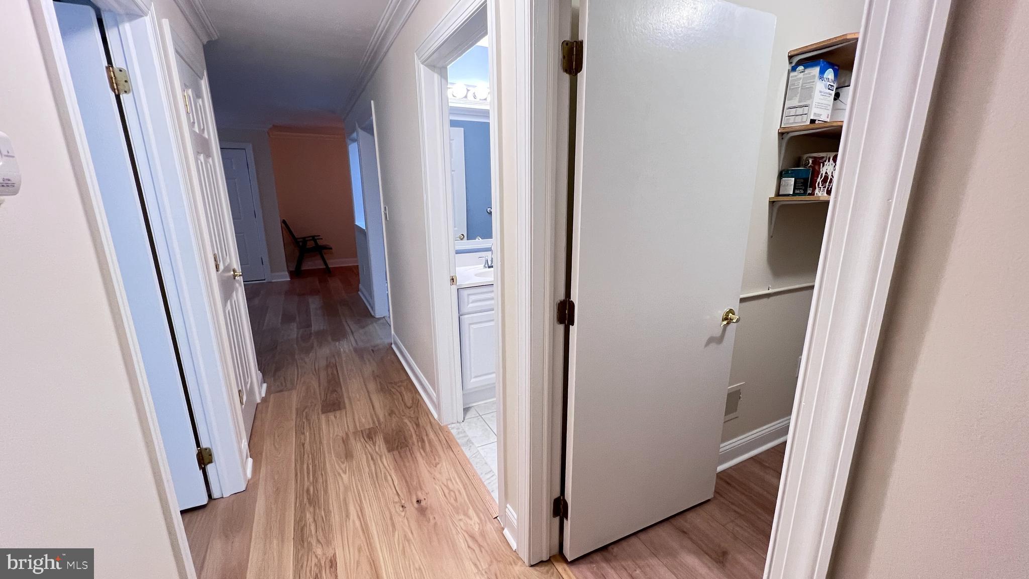 7 Voscek Court Lawrence Township, NJ 08648 - Photo 11 of 19 a view of a hallway with wooden floor and staircase