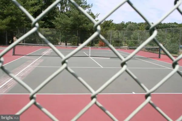 a swimming pool with outdoor seating and yard