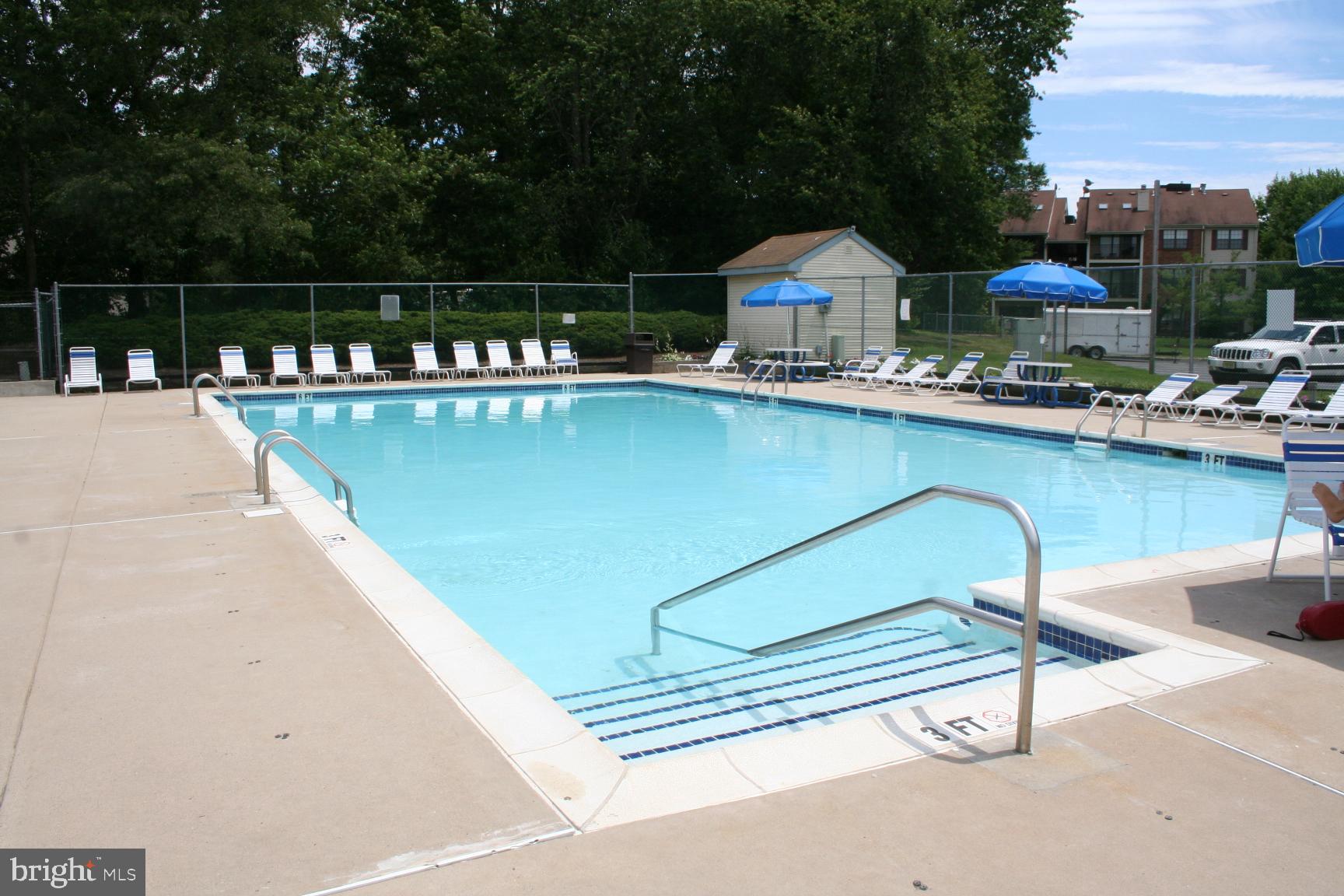 7 Voscek Court Lawrence Township, NJ 08648 - Photo 18 of 19 a swimming pool with outdoor seating and yard
