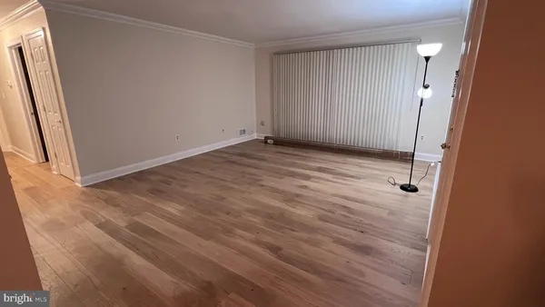 a bathroom with a granite countertop sink a toilet a mirror and shower