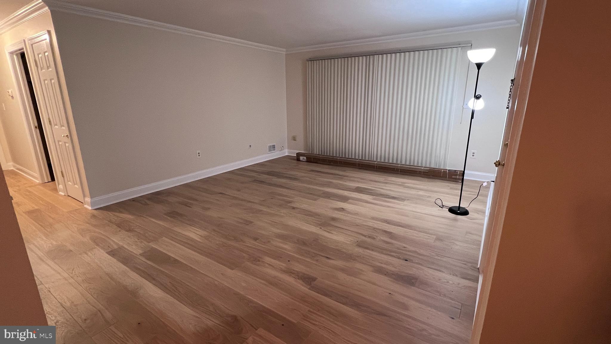 7 Voscek Court Lawrence Township, NJ 08648 - Photo 6 of 19 an empty room with wooden floor