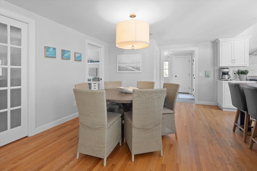 8 Village Lane Hingham, MA 02043 - Photo 14 of 36 a view of a dining room with furniture and wooden floor