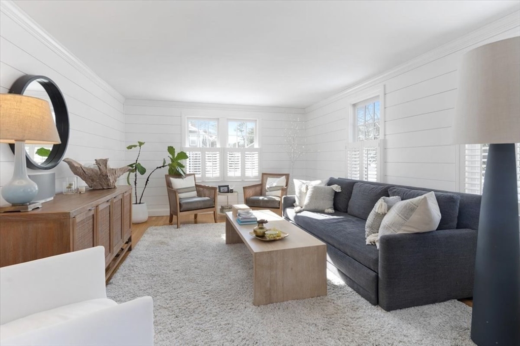 8 Village Lane Hingham, MA 02043 - Photo 16 of 36 a living room with furniture and a large window