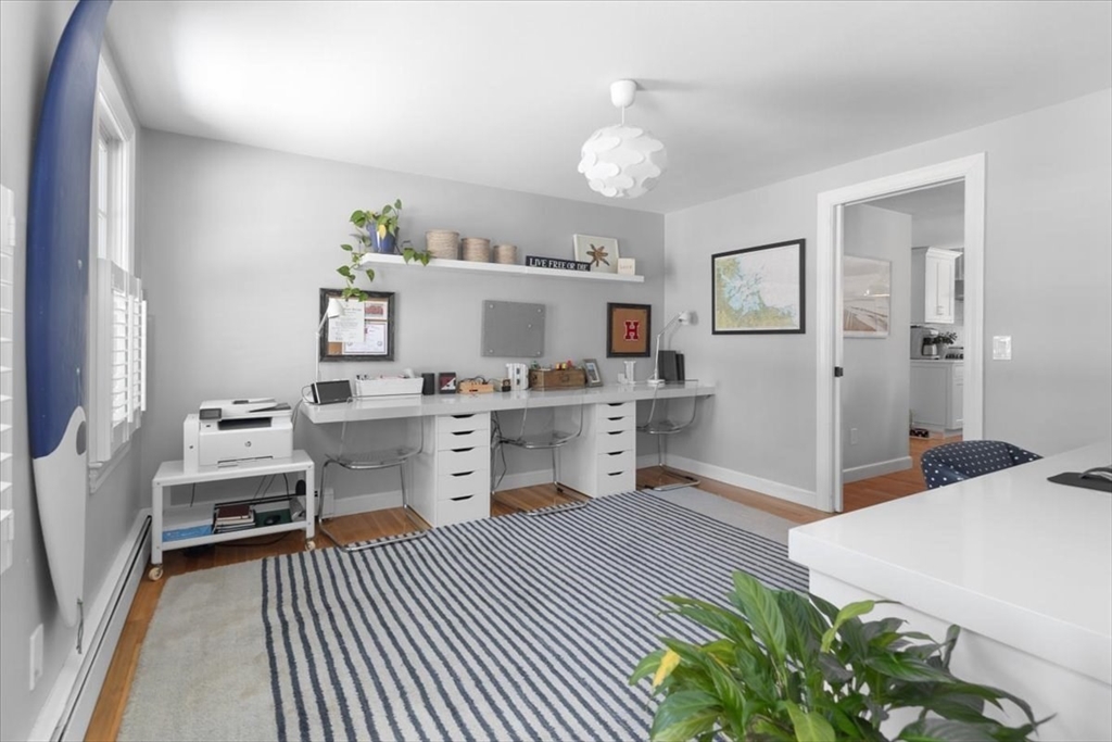 8 Village Lane Hingham, MA 02043 - Photo 17 of 36 a room with furniture a chandelier and a view of kitchen