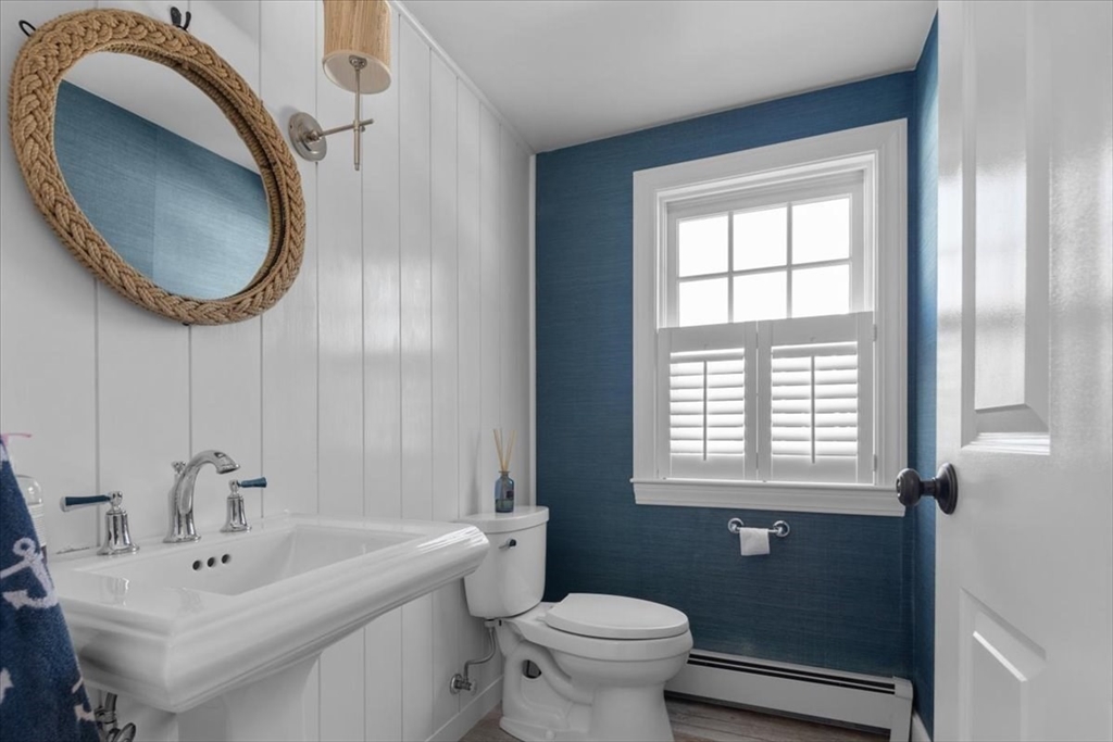 8 Village Lane Hingham, MA 02043 - Photo 20 of 36 a bathroom with a sink and a mirror
