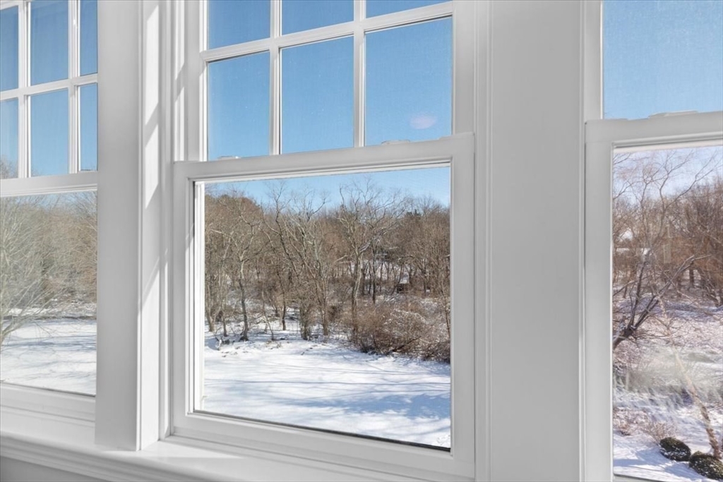 8 Village Lane Hingham, MA 02043 - Photo 23 of 36 a view of a room that has a glass door and a window
