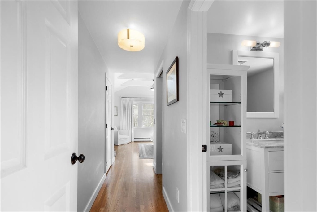 8 Village Lane Hingham, MA 02043 - Photo 24 of 36 a view of a bathroom with dual sinks
