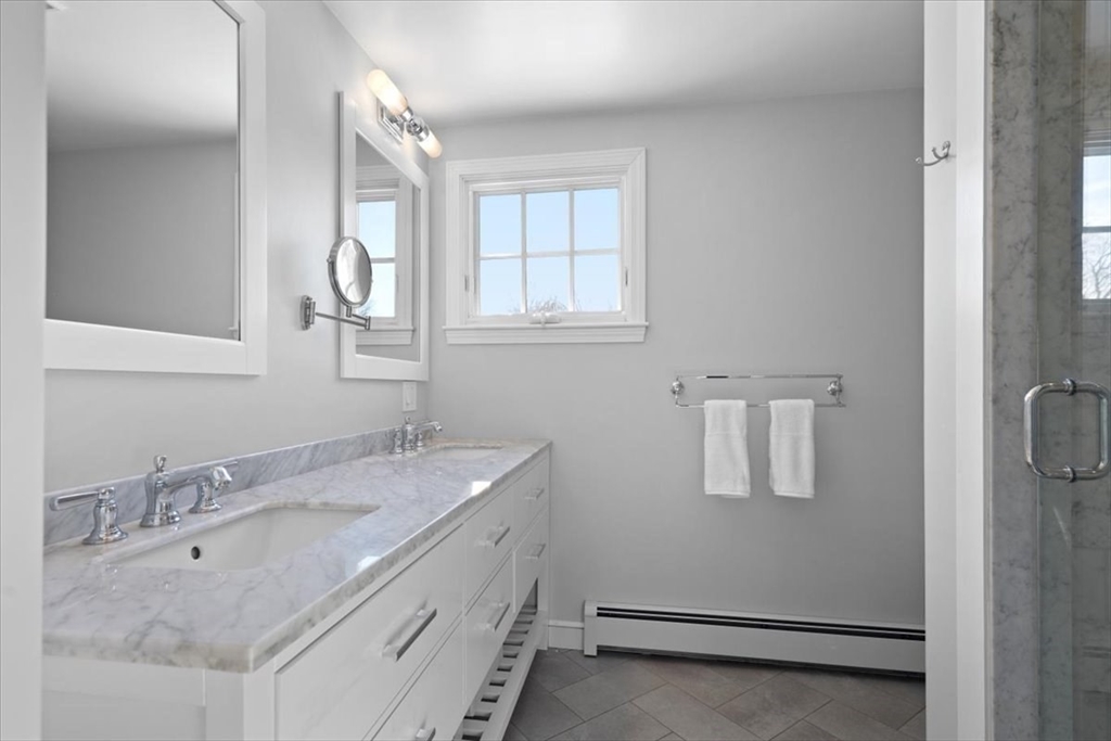 8 Village Lane Hingham, MA 02043 - Photo 25 of 36 a bathroom with a sink and a mirror