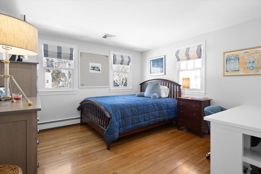 8 Village Lane Hingham, MA 02043 - Photo 27 of 36 a bedroom with a bed and a window