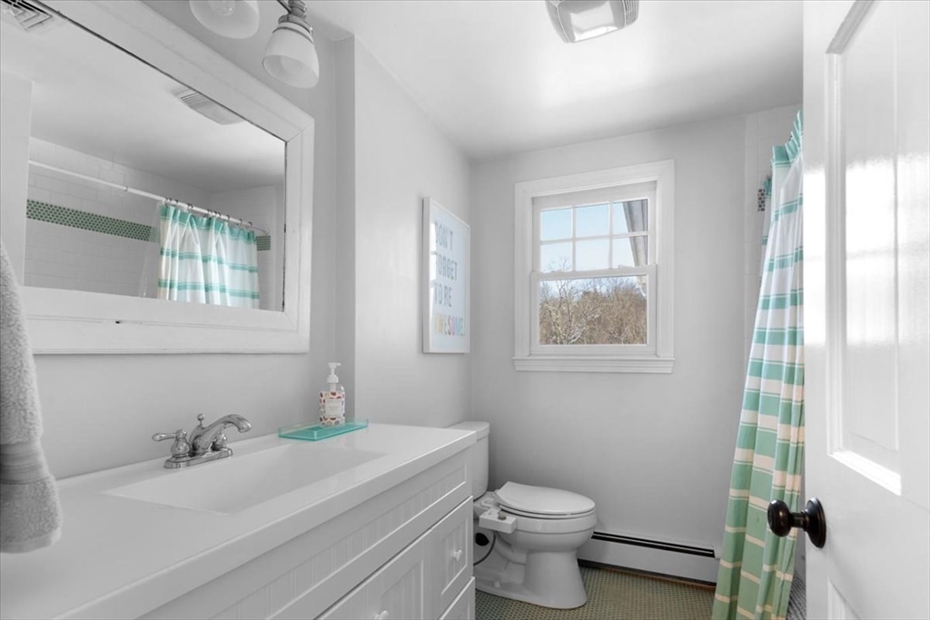 8 Village Lane Hingham, MA 02043 - Photo 29 of 36 a bathroom with a sink a toilet and tub