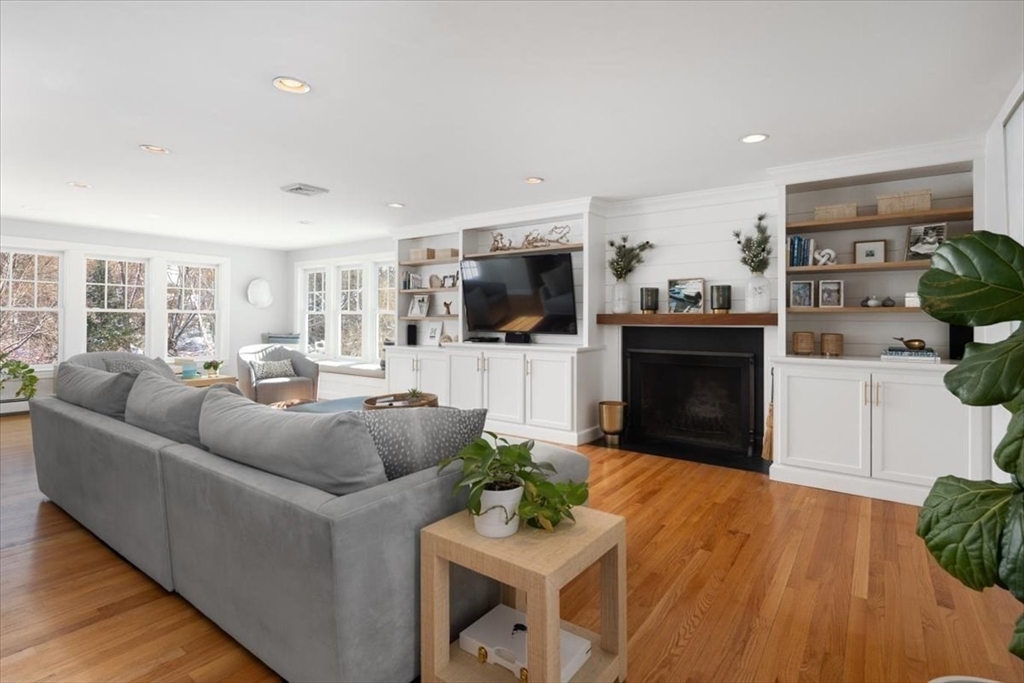 8 Village Lane Hingham, MA 02043 - Photo 3 of 36 a living room with furniture a flat screen tv and a fireplace