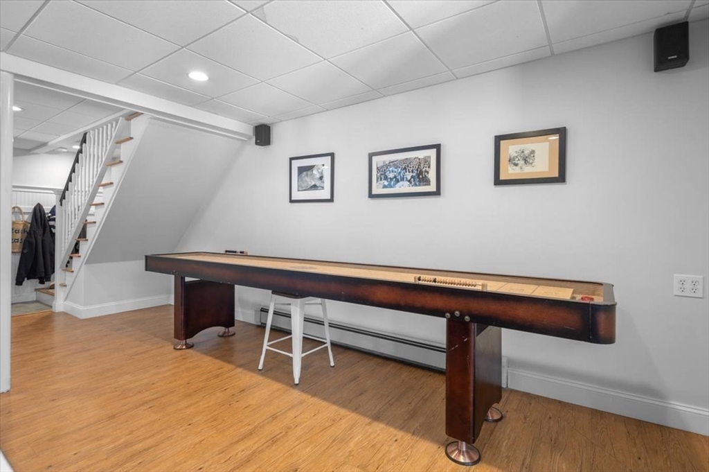 8 Village Lane Hingham, MA 02043 - Photo 32 of 36 a room with wooden floor and furniture