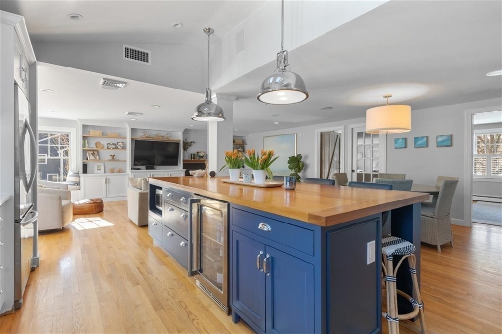 8 Village Lane Hingham, MA 02043 - Photo 9 of 36 a kitchen with stainless steel appliances granite countertop a sink a stove and a wooden floors