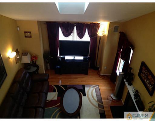 179 Salem Road North Brunswick, NJ 08902 - Photo 12 of 23 a living room with furniture and a flat screen tv