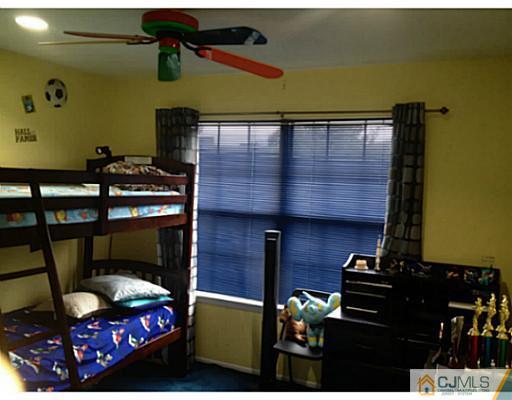 179 Salem Road North Brunswick, NJ 08902 - Photo 17 of 23 a room with furniture and a fireplace