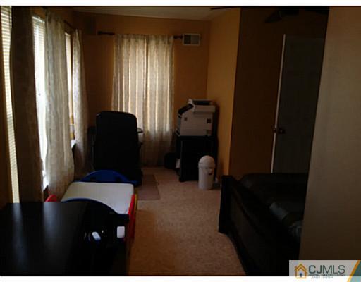 179 Salem Road North Brunswick, NJ 08902 - Photo 19 of 23 a living room with furniture and a window