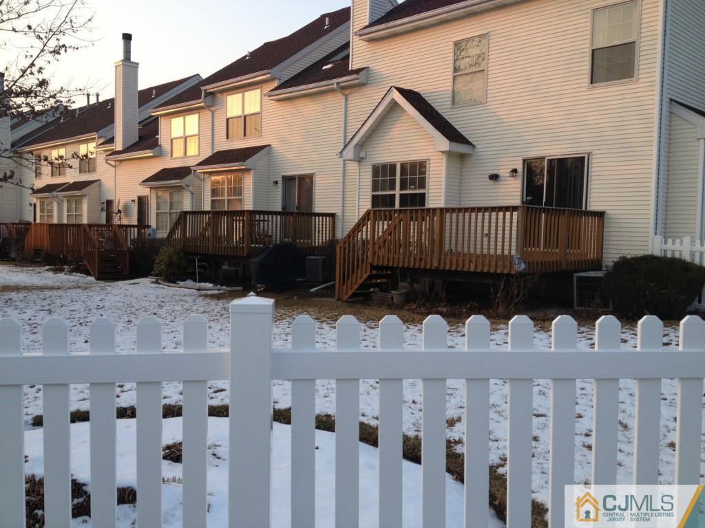 179 Salem Road North Brunswick, NJ 08902 - Photo 22 of 23 a view of a brick house with wooden fence