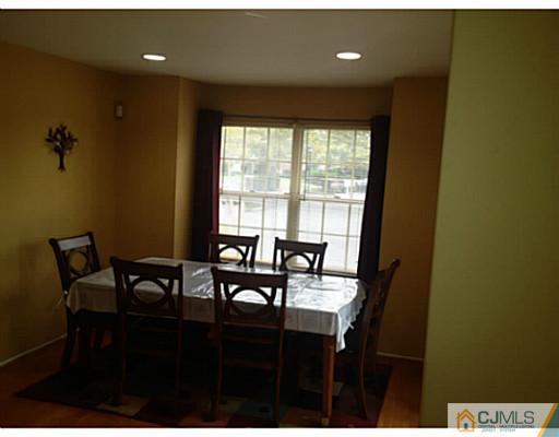 179 Salem Road North Brunswick, NJ 08902 - Photo 6 of 23 a view of a dining room with furniture and a window