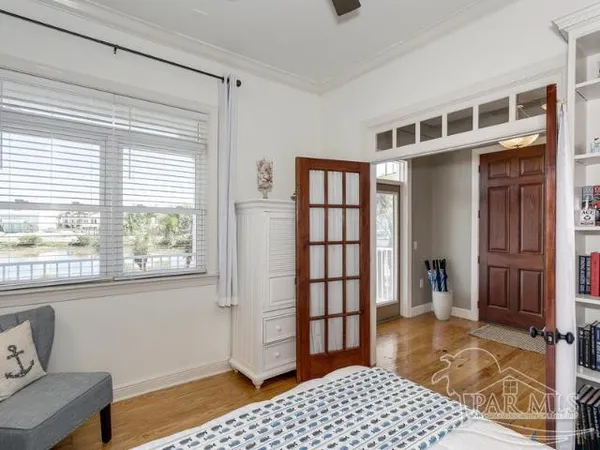 a bedroom with furniture and window