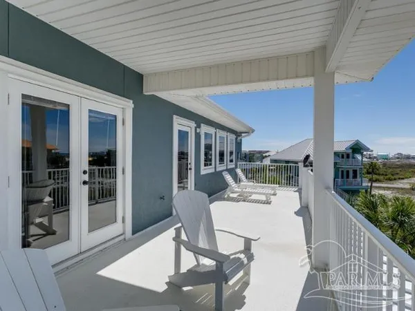 a view of a patio with table and chairs