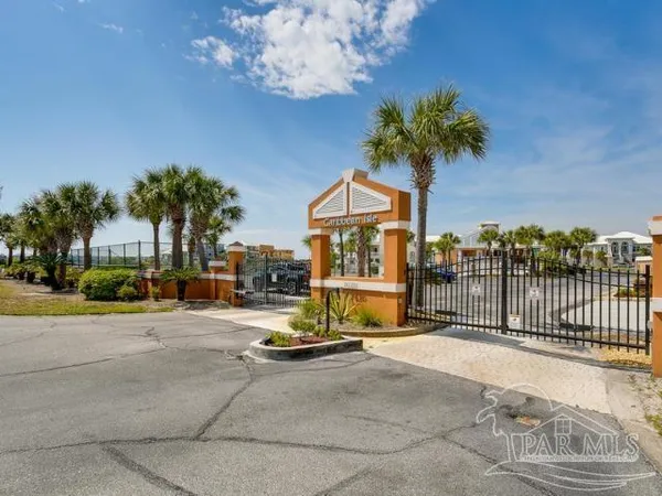a view of a street with a building in the background